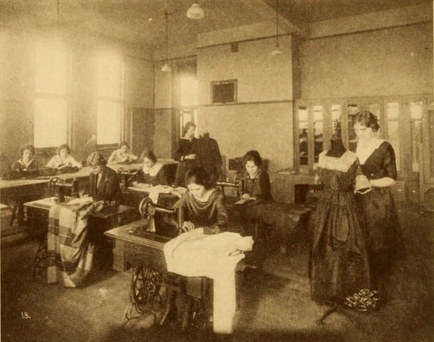Girls learning garment construction in 1921
